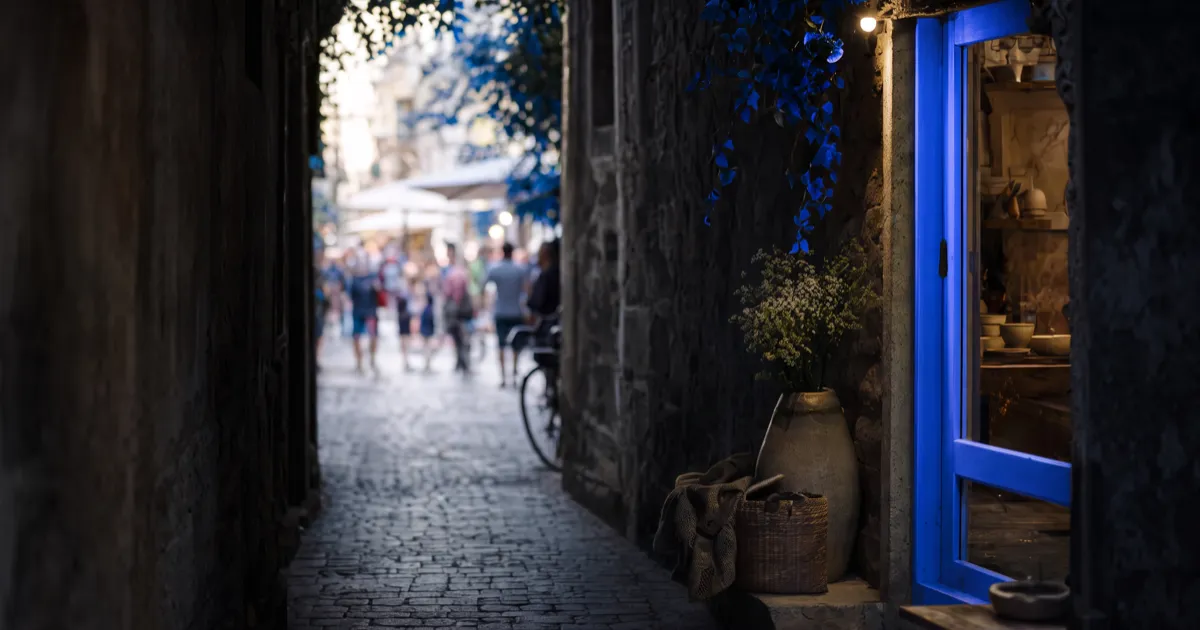 A shop hidden down a quiet alley off a busy street, a metaphor for a website not showing up on Google
