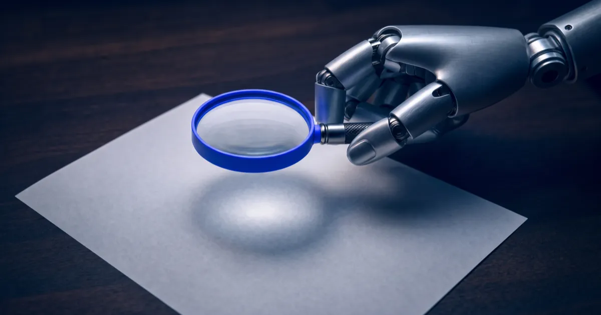 A robot hand reading a sheet of paper through a magnifying glass, illustrating what llms.txt is for AI crawlers